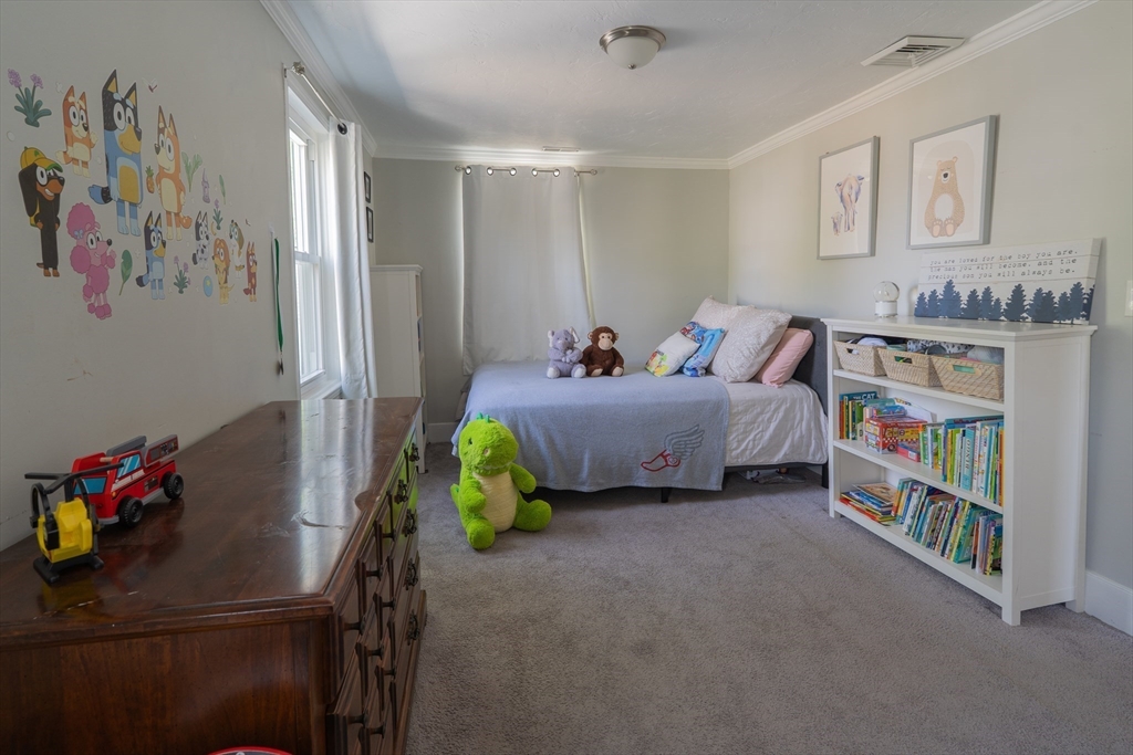 35 Neponset Street Canton, MA 02021 - Photo 21 of 29 a bedroom with furniture and a book shelf