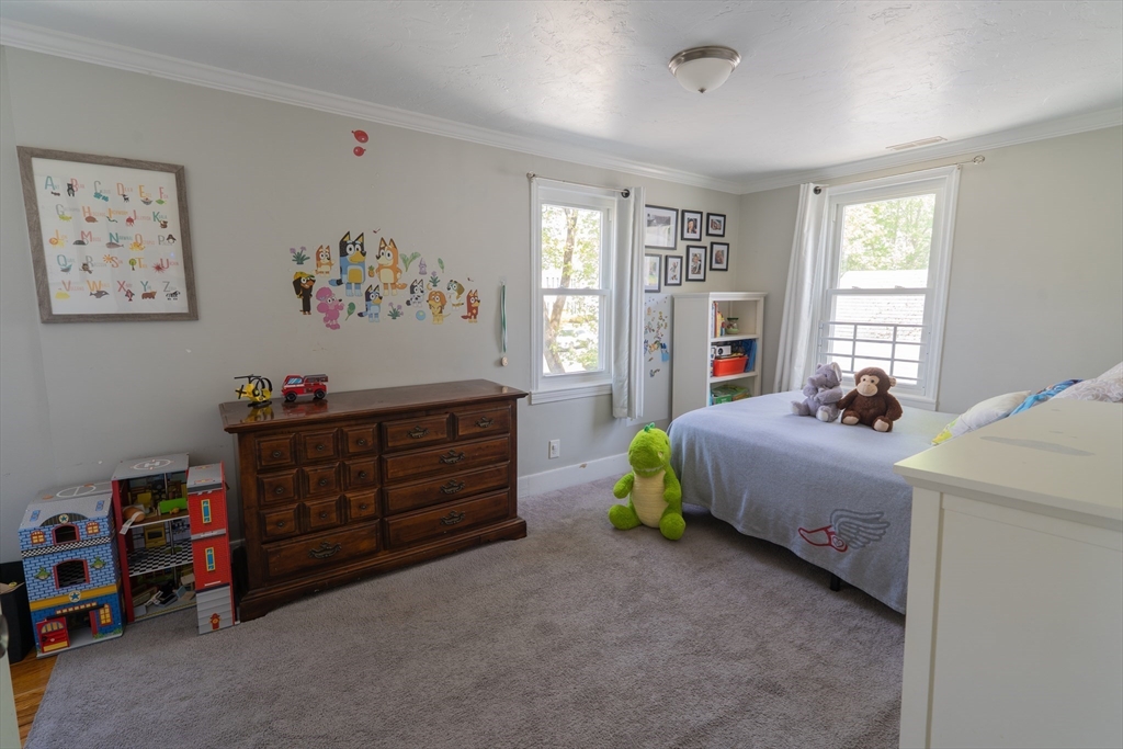 35 Neponset Street Canton, MA 02021 - Photo 22 of 29 a bed room with a bed and a window
