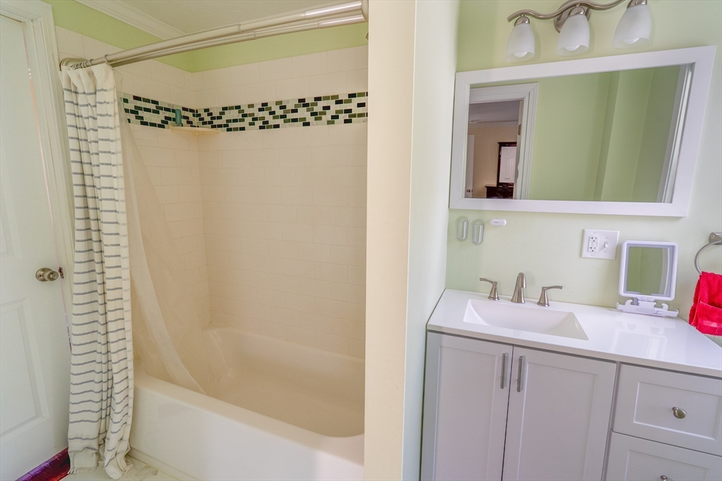 35 Neponset Street Canton, MA 02021 - Photo 23 of 29 a bathroom with a sink a mirror and a shower