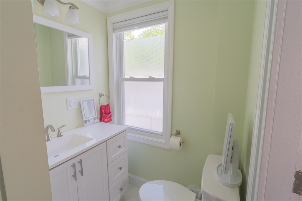 35 Neponset Street Canton, MA 02021 - Photo 24 of 29 a bathroom with a sink vanity mirror and toilet