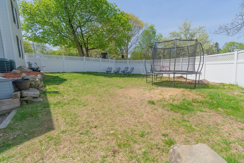 35 Neponset Street Canton, MA 02021 - Photo 26 of 29 a backyard with a table and chairs