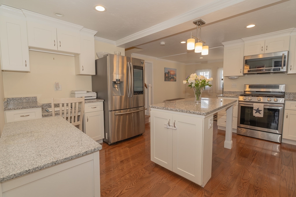 35 Neponset Street Canton, MA 02021 - Photo 7 of 29 a kitchen with granite countertop a refrigerator stove and oven