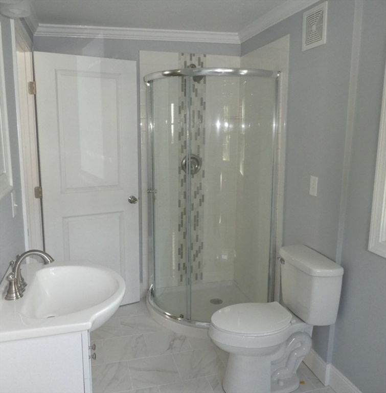 35 Neponset Street Canton, MA 02021 - Photo 9 of 29 a bathroom with a shower and a toilet