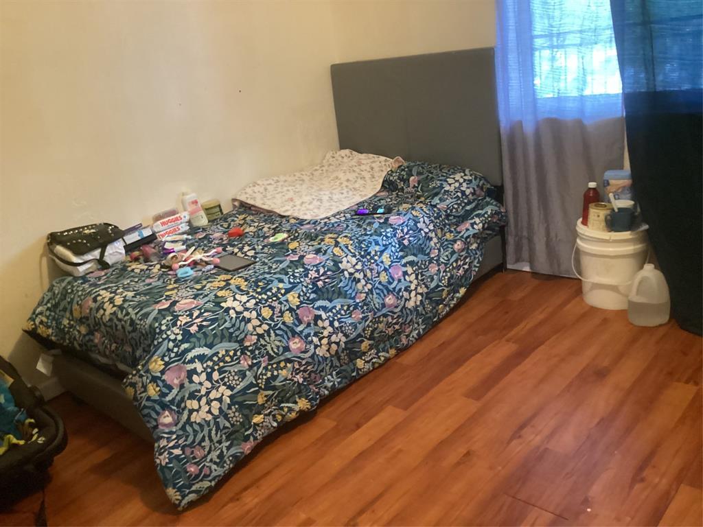 3161 Northwest 47th Terrace, Unit 317 Lauderdale Lakes, FL 33319 - Photo 14 of 20 a bed sitting in a bedroom next to a window