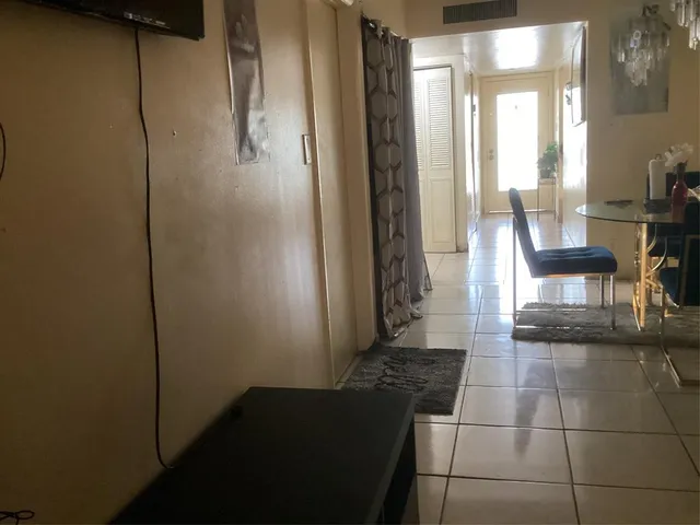 a living room with a fireplace and a table