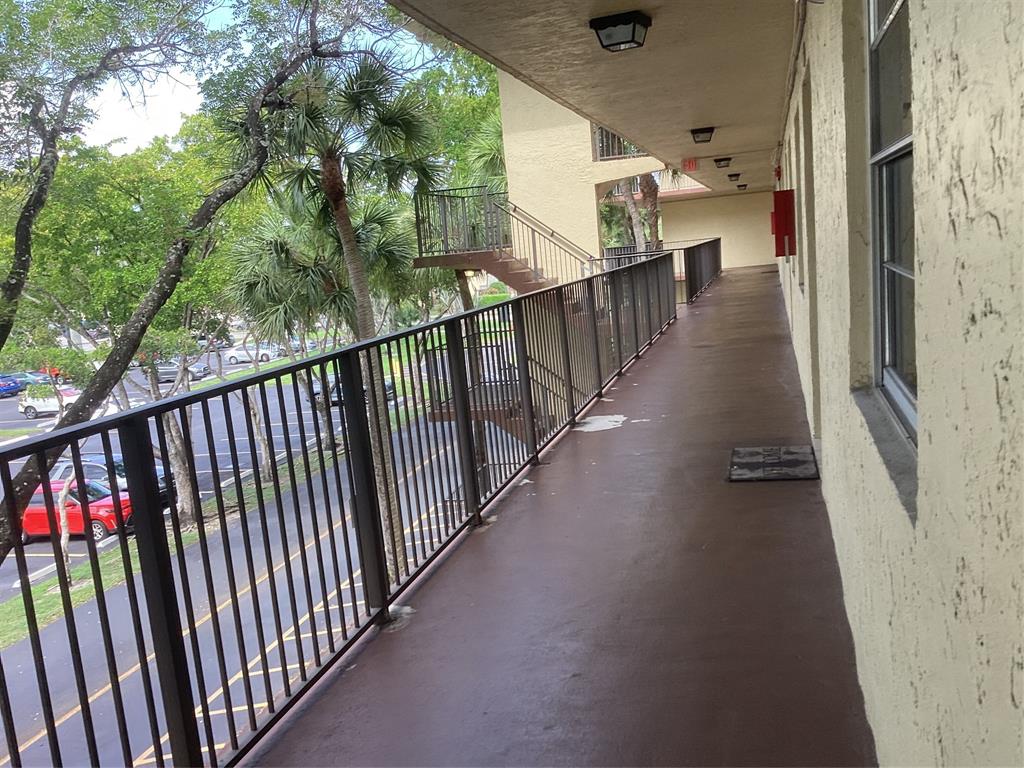 3161 Northwest 47th Terrace, Unit 317 Lauderdale Lakes, FL 33319 - Photo 20 of 20 a view of a balcony with wooden floor