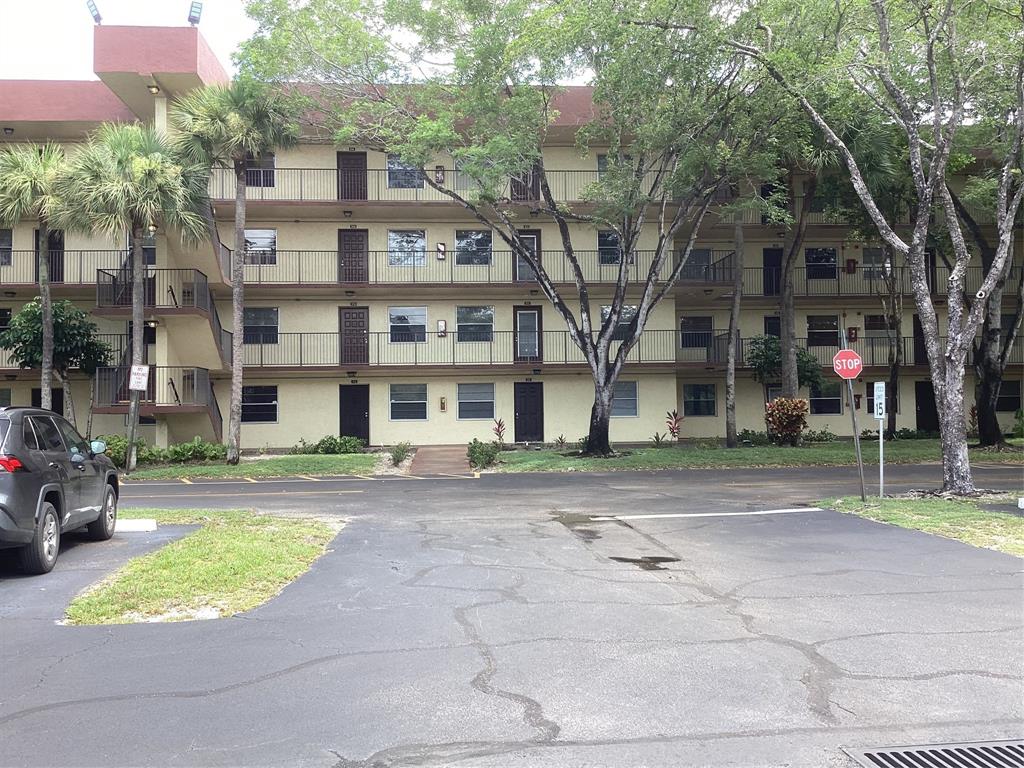 3161 Northwest 47th Terrace, Unit 317 Lauderdale Lakes, FL 33319 - Photo 3 of 20 a view of a building with a street
