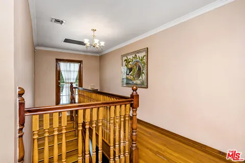 a view of a hallway with windows