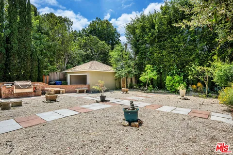 a view of a backyard with a sitting area
