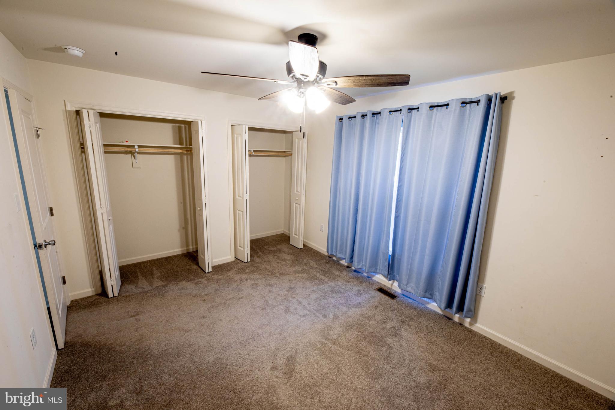 26300 Fire Tower Road Seaford, DE 19973 - Photo 36 of 52 an empty room with closet and a ceiling fan