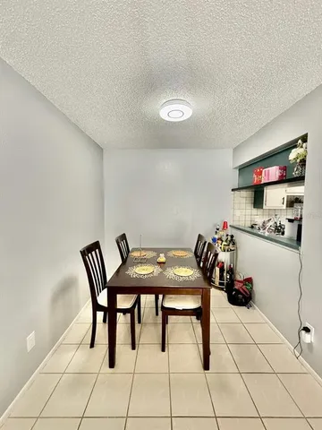 a room with furniture and white walls