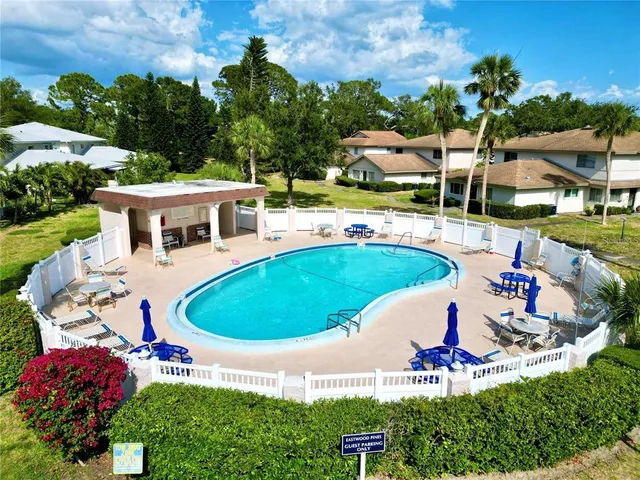 a view of a swimming pool with a patio