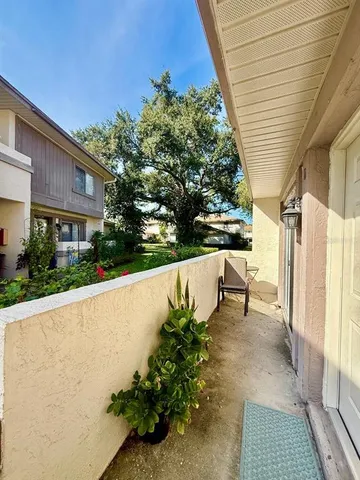 a view of balcony with a potted plant
