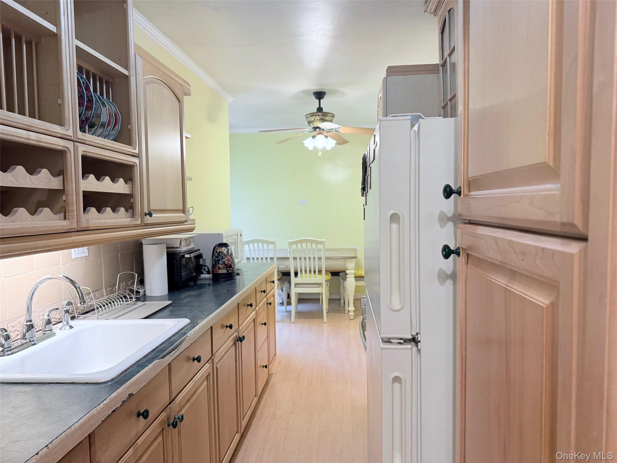 83-30 98th Street, Unit 6M Queens, NY 11421 - Photo 3 of 10 a bathroom with a double vanity sink a mirror and a shower