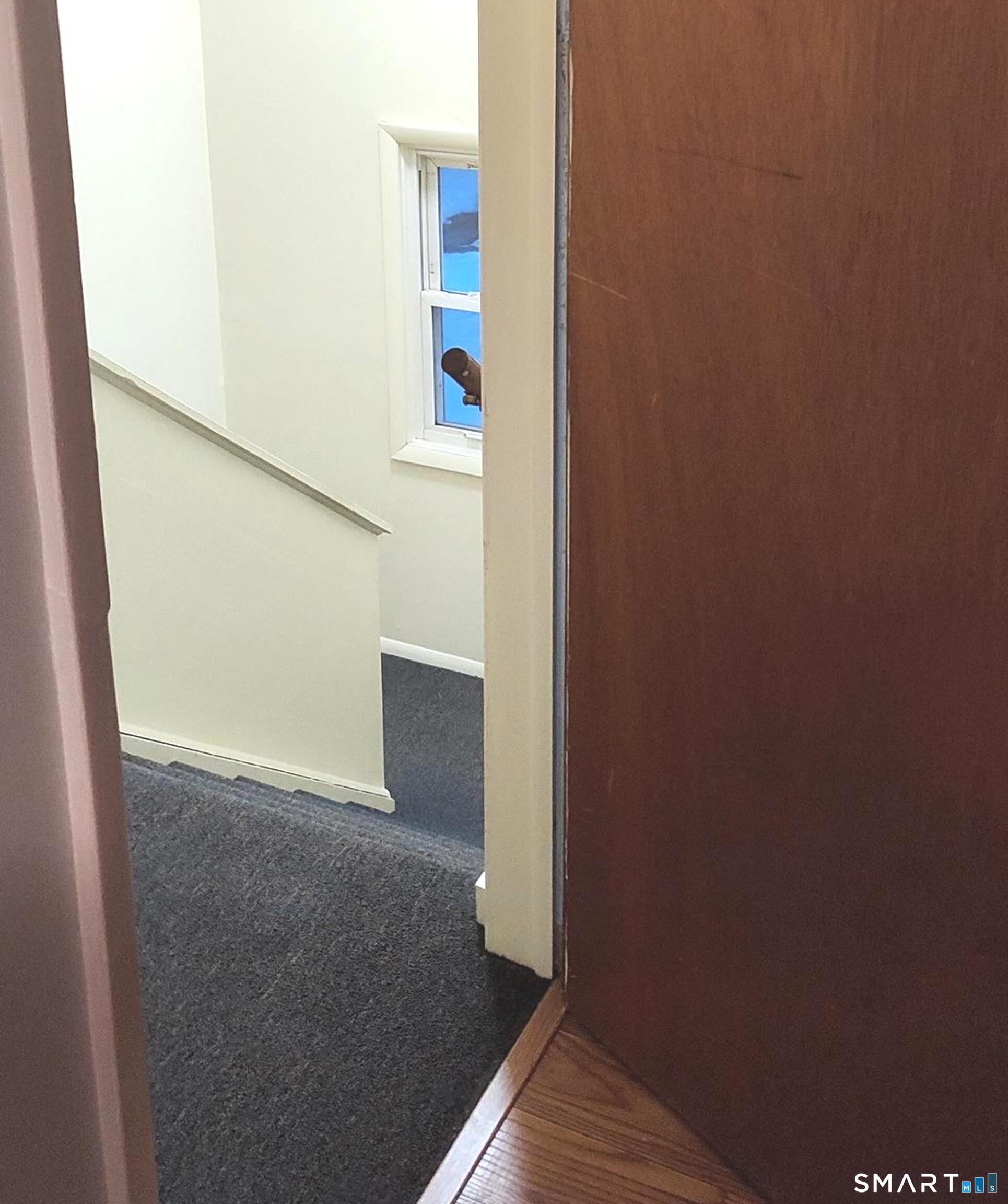 53 Hiltbrand Road, Unit 310 Bristol, CT 06010 - Photo 5 of 39 Rear Door Staircase