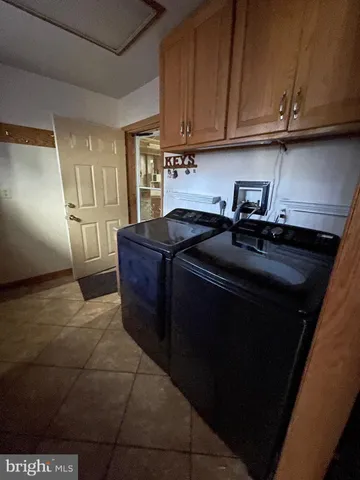 a kitchen with a sink a stove and cabinets