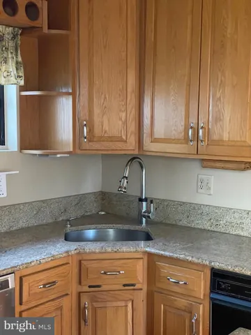 a kitchen with appliances cabinets and a counter top space