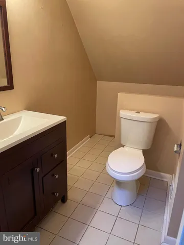 a bathroom with a toilet and a sink
