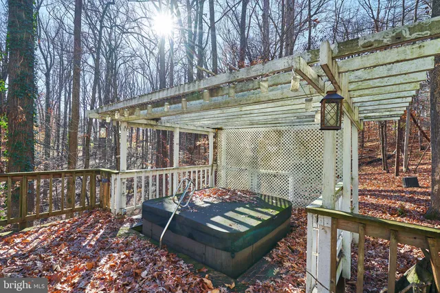 a view of a chair and tables in the balcony