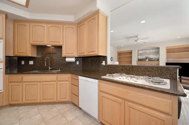 a dining room with furniture window and wooden floor