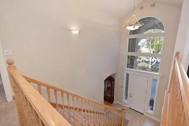 a bedroom with a large bed and a large window