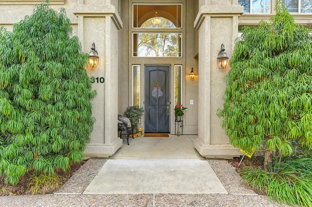 front view of a house with a garden