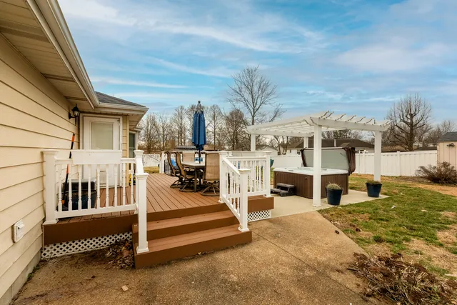 a view of a house with backyard sitting area and garden