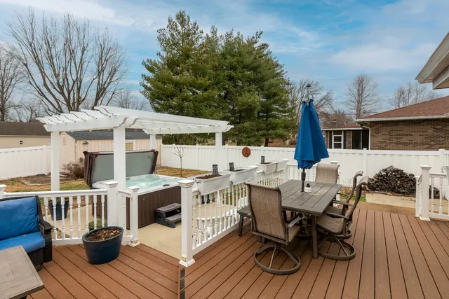 a view of a house with swimming pool and sitting area