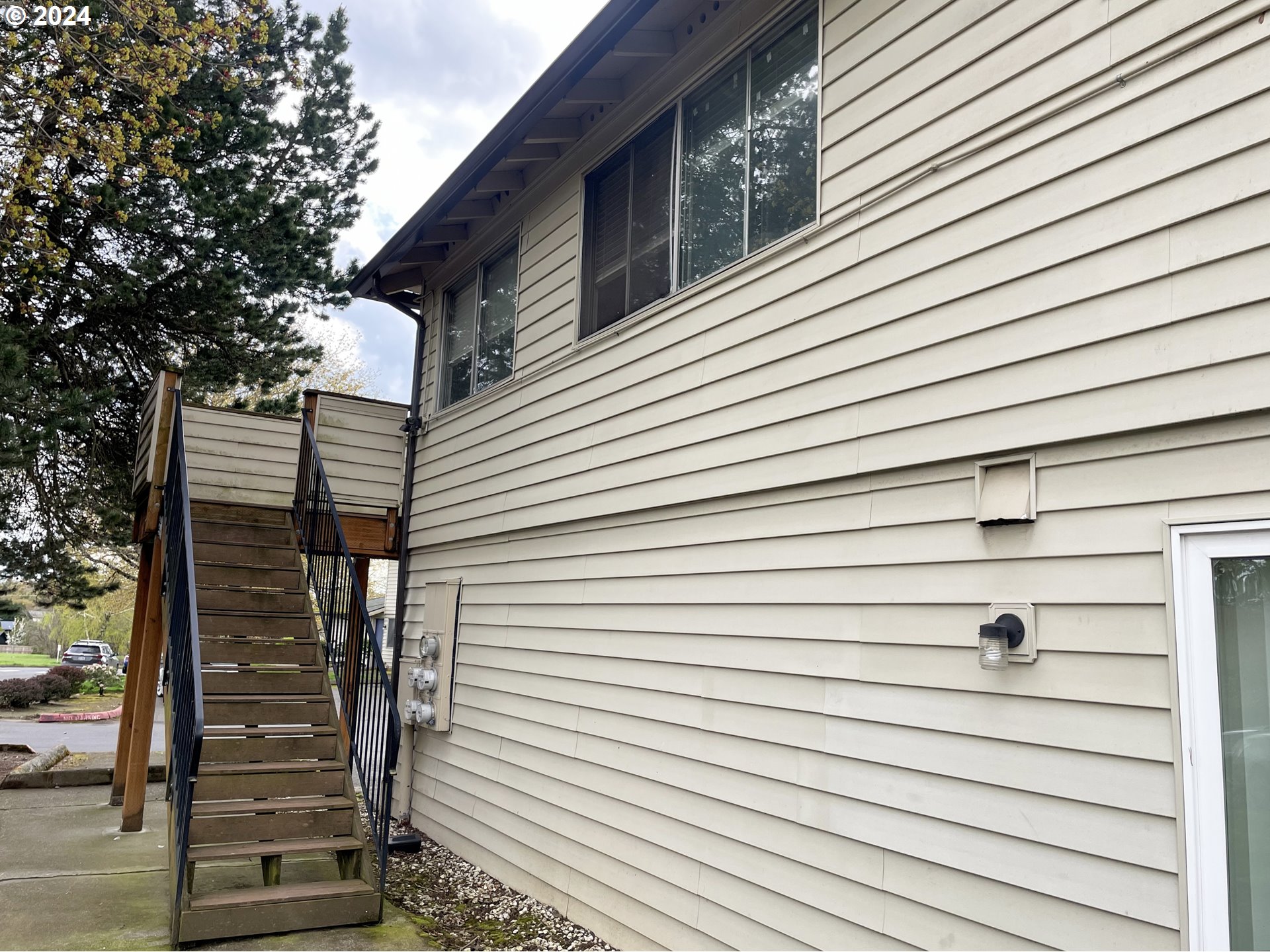 2797 Northeast Rene Avenue, Unit 25C Gresham, OR 97030 - Photo 5 of 9 a view of a house with a door