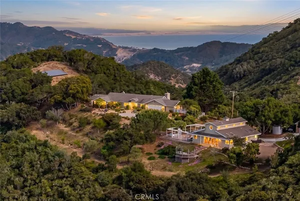 an aerial view of residential house and green space