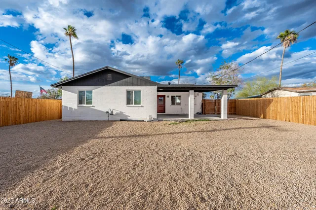 a view of a house with a snow in the yard