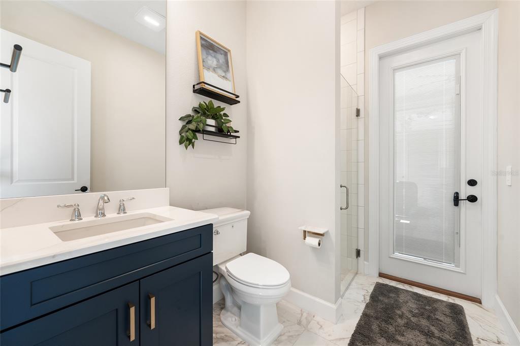 10175 Brocksport Circle Gotha, FL 34734 - Photo 28 of 54 a bathroom with a sink a toilet and shower
