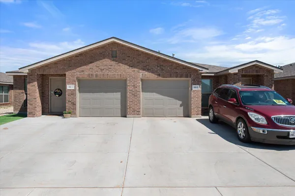 a front view of a house with a garage