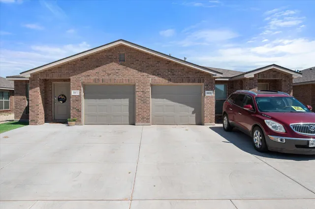 a front view of a house with a garage