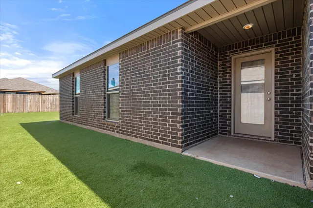a view of a backyard with a garden