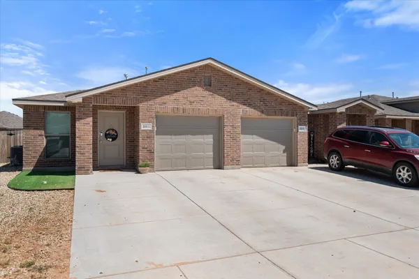 a view of a car in front of a house
