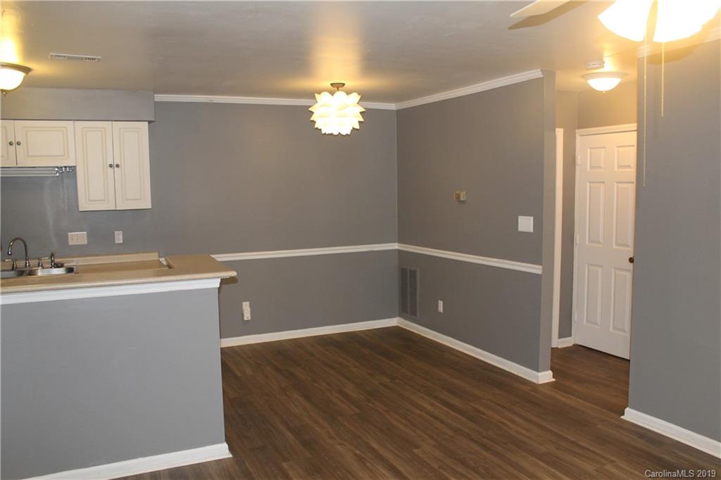 11203 Johnston Road Charlotte, NC 28226 - Photo 5 of 17 a view of a room with wooden floor