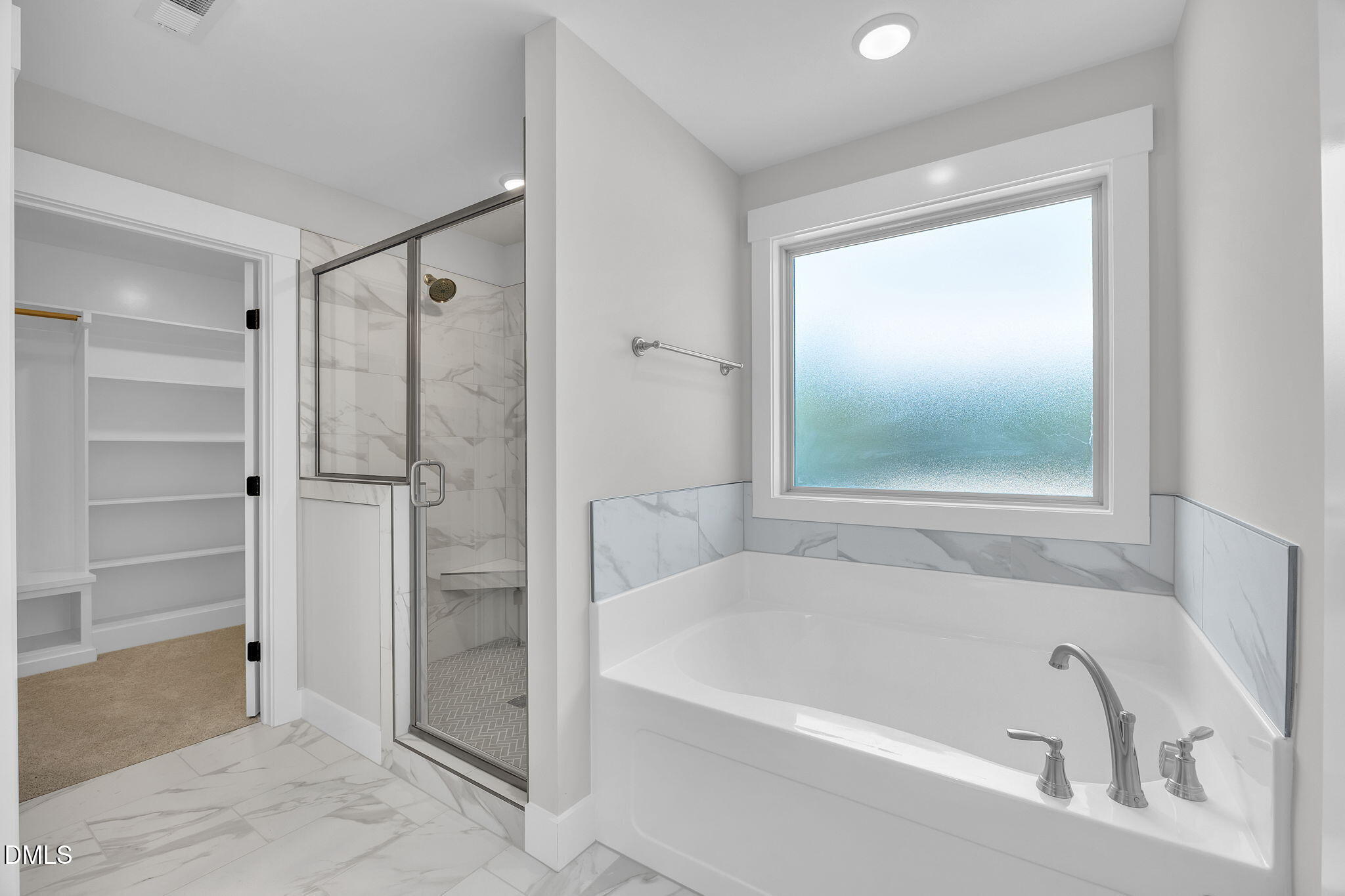 378 Freedom Ridge Drive Smithfield, NC 27577 - Photo 32 of 33 a bathroom with a bathtub and a shower