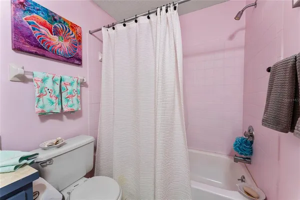a bathroom with a sink a vanity and a toilet