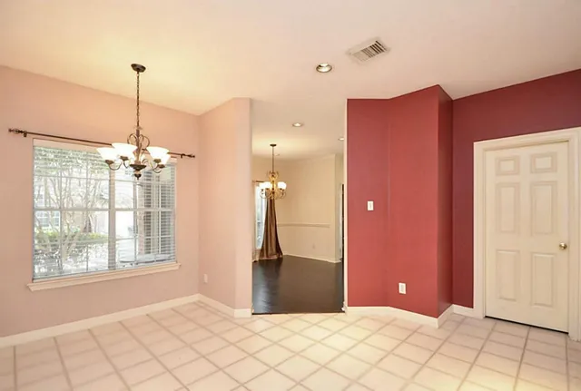a view of a hallway with windows