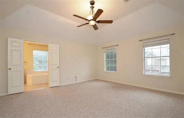 a view of an empty room with a window