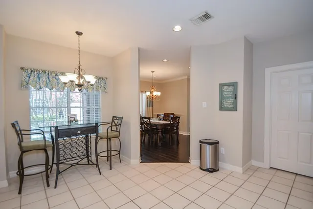 a dining room filled with furniture and window