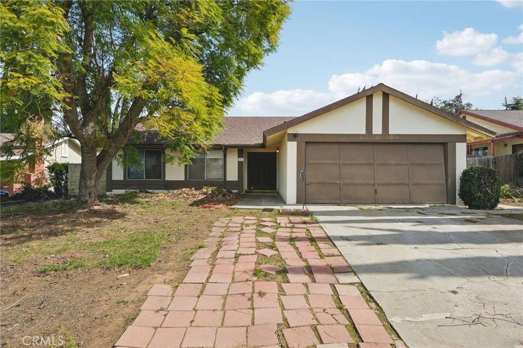 521 Bond Street Redlands, CA 92373 - Photo 1 of 1 a front view of a house with a yard