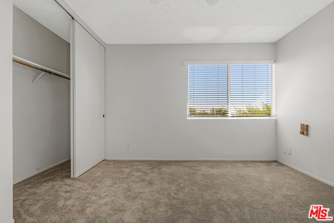 2695 Cordelia Road Los Angeles, CA 90049 - Photo 29 of 33 a view of an empty room with a window