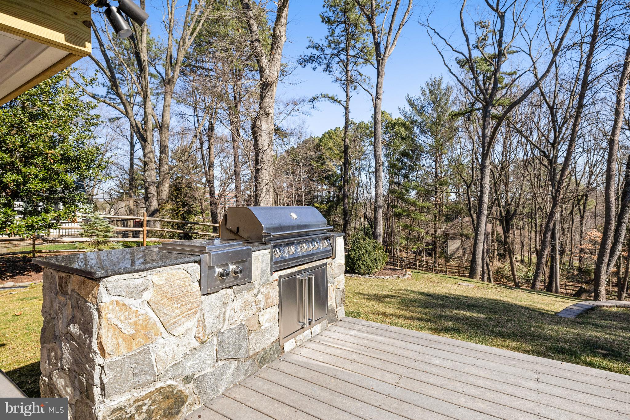 1807 Post Oak Trail Reston, VA 20191 - Photo 59 of 79 a view of a yard with wooden fence