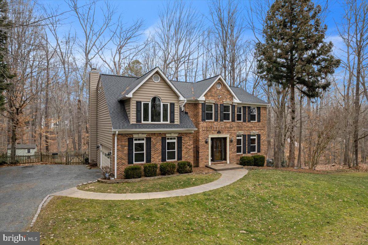 650 Small Reward Road Huntingtown, MD 20639 - Photo 3 of 21 a front view of a house with a yard