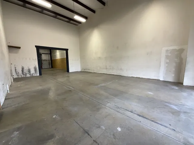 a view of empty room with a fireplace