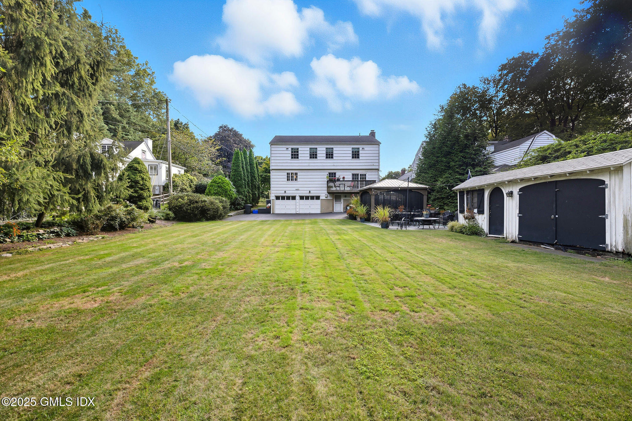 25 Buxton Lane Riverside, CT 06878 - Photo 15 of 16 a view of a house with a yard