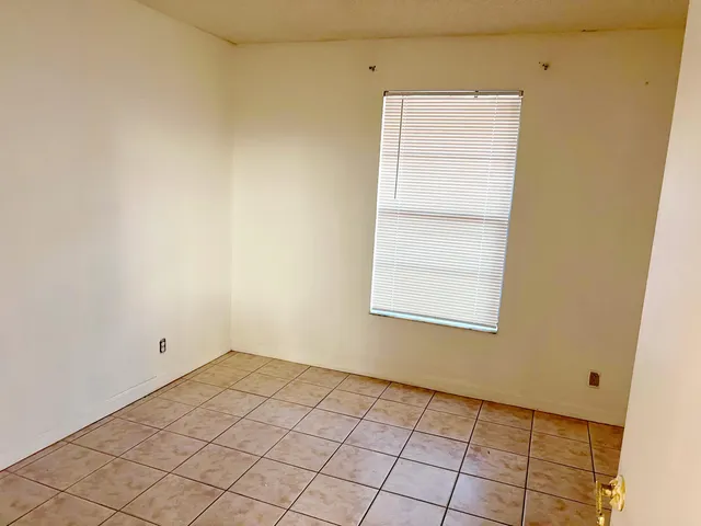 a view of a room that has a window in it