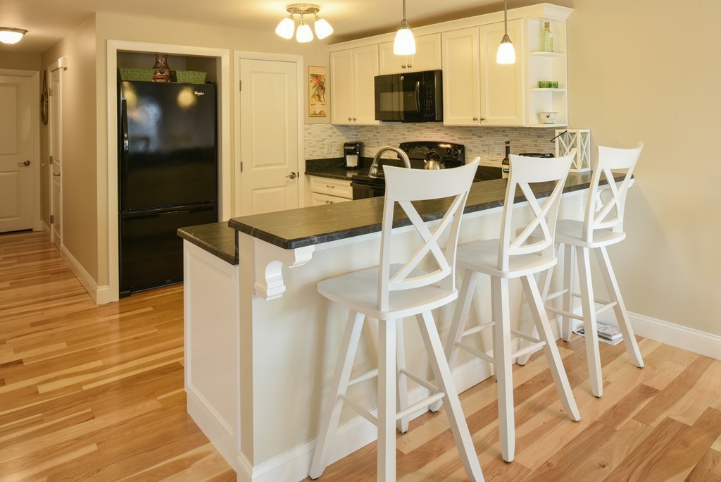 18 Atlantic Road, Unit 35 Gloucester, MA 01930 - Photo 3 of 24 a view of a kitchen with a sink and microwave